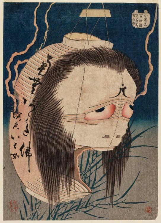japanese ghost with paper on face